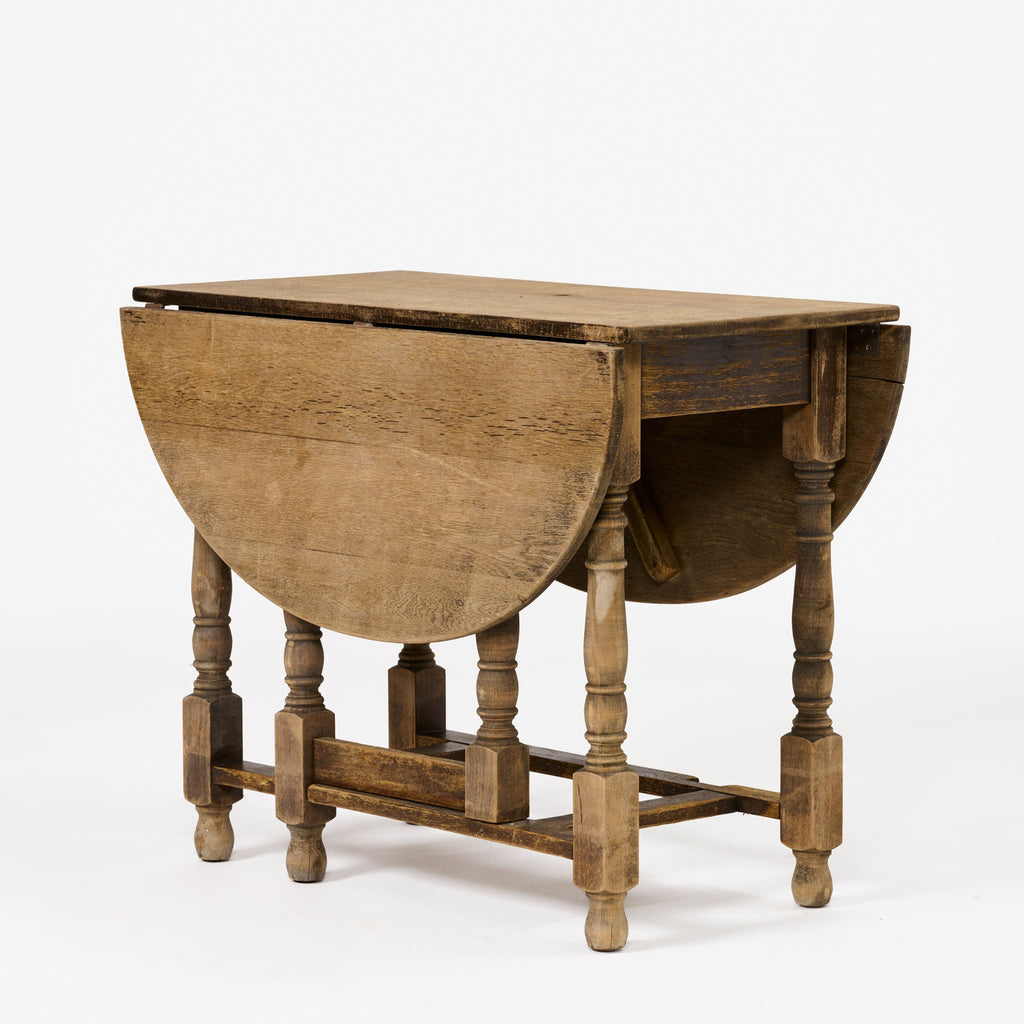 Table ovale antique à abattants et pieds rabattables