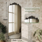 Miroir sur pied arqué à motif floral baroque