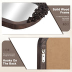 Miroir sur pied arqué en bois massif sculpté