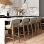 Tabouret de bar moderne Gracie, chaise rembourrée en tissu bouclé et pieds en bois brossé