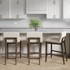 Tabouret de bar moderne Gracie, chaise rembourrée en tissu bouclé et pieds en bois brossé