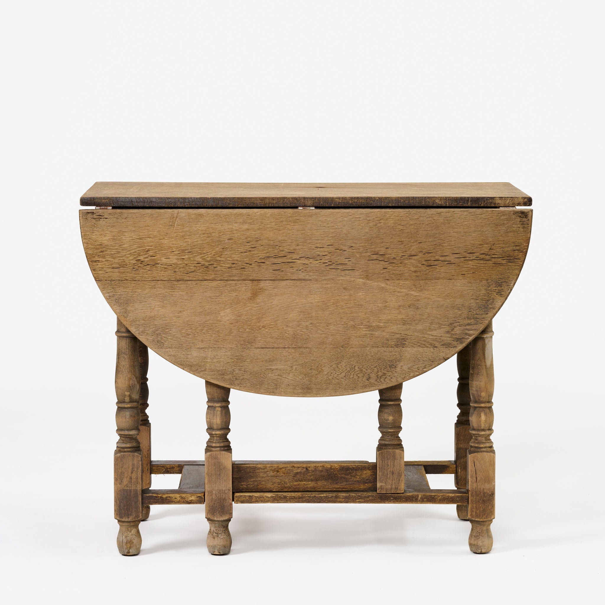 Table ovale antique à abattants et pieds rabattables